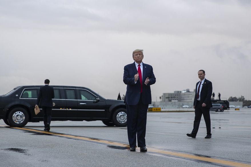 President Donald Trump pauses as he arrives at Miami International Airport en route to attend the Republican National Committee winter meetings, Thursday, Jan. 23, 2020, in Miami. (AP Photo/ Evan Vucci)