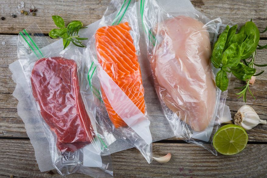 Beef, chicken and salmon in vacuum plastic bag for sous vide cooking. (Shutterstock.com)