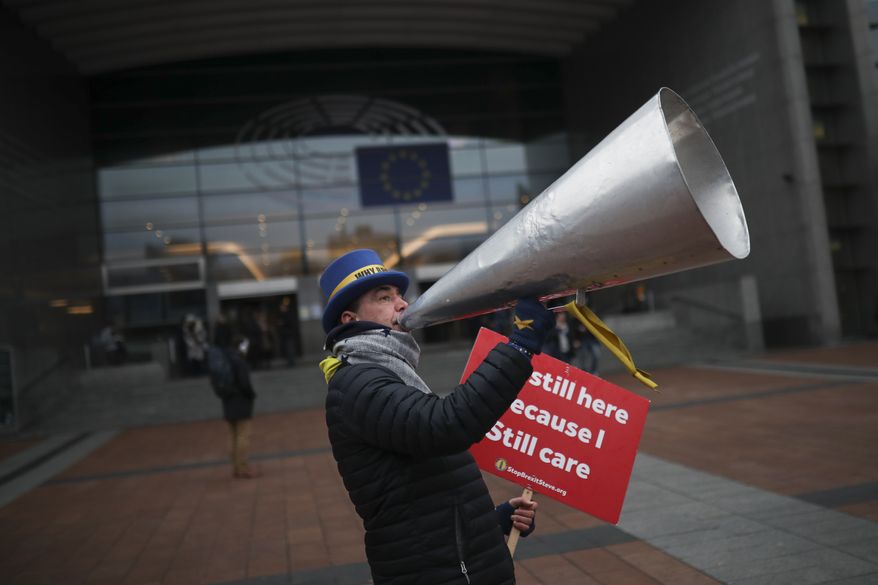 Anti-Brexit campaigner Steve Bray reacts to the photographer after a protest outside the European Parliament in Brussels, Thursday, Jan. 23, 2020. (AP Photo/Francisco Seco)
