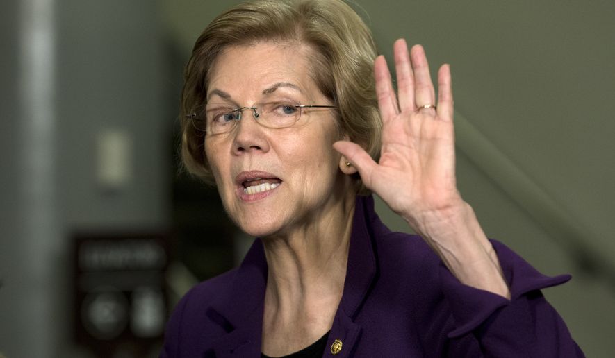 Democratic presidential candidate Sen. Elizabeth Warren, D-Mass., talks to the media as she walks to the Senate chamber prior to the start of the impeachment trial of President Donald Trump at the U.S. Capitol, Thursday, Jan. 23, 2020, in Washington. (AP Photo/Jose Luis Magana)