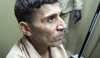 Mustafa al-Imam seen after his capture in October 2017.  (FBI via AP)