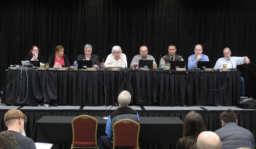 The Alaska Marijuana Control Board listens to testimony during a public comment period on Thursday, Jan. 23, 2020, in Juneau, Alaska. Alaska&#x27;s legal marijuana industry hit a milestone Thursday, as regulators approved the first retail stores that will be allowed to have customers consume marijuana products on site.(AP Photo/Becky Bohrer)