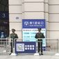 Paramilitary police stand guard at an entrance to the closed Hankou Railway Station in Wuhan in central China&#39;s Hubei Province, Thursday, Jan. 23, 2020. China closed off a city of more than 11 million people Thursday in an unprecedented effort to try to contain a deadly new viral illness that has sickened hundreds and spread to other cities and countries in the Lunar New Year travel rush. (Thepaper via AP)