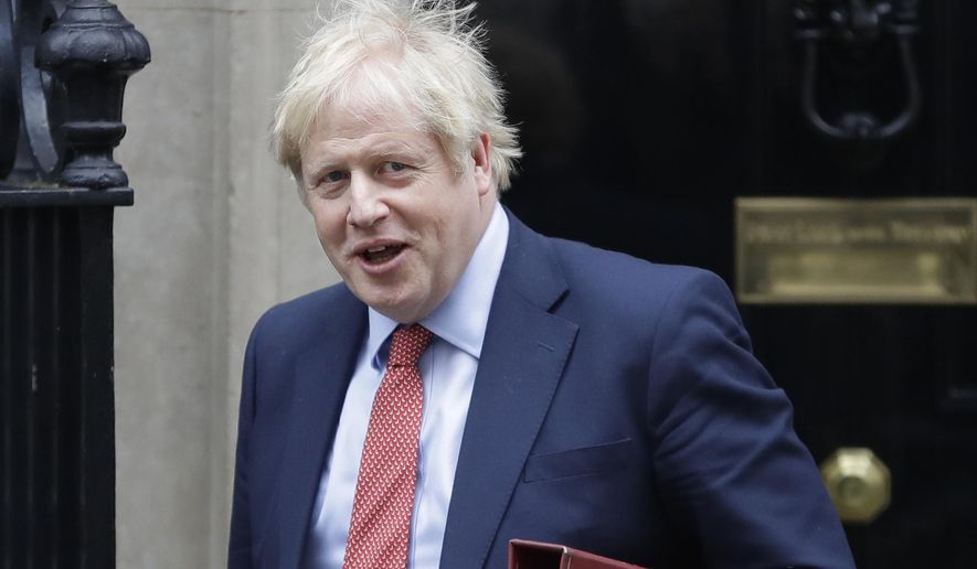 Britain&#x27;s Prime Minister Boris Johnson leaves 10 Downing Street to attend the weekley session of Prime Ministers Questions in Parliament in London, Wednesday, Jan. 22, 2020. (AP Photo/Kirsty Wigglesworth)