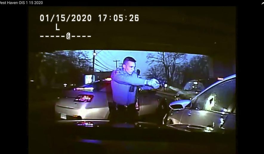 This Jan. 15, 2020, still image from dashboard camera video released by the Connecticut State Police shows Trooper Brian North, left, after he discharged his weapon beside vehicle stopped in West Haven, Conn. North fatally shot Mubarak Soulemane following a high-speed chase along Interstate 95 after Soulemane,19, had carjacked the vehicle in Norwalk, Conn. Clergy and relatives of Soulemane have called for the trooper be sent home on suspension and are asking for more de-escalation training. (Connecticut State Police via AP)
