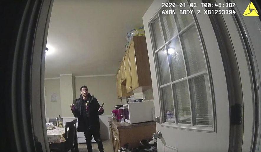This image made from police body camera video taken on Jan. 2, 2020, and released by the Connecticut State Police shows Michael Gregory with a knife in his girlfriend&#x27;s home, talking to Ansonia police officers who were responding to her report, before Gregory was shot dead in Ansonia, Conn. The fatal shooting by police in Connecticut has raised questions about whether officers did enough to diffuse the situation and the fallibility of stun guns. Ansonia police say one of their officers was forced to shoot Gregory when he came at police with the knife on Jan. 2. The time and date stamp on the image indicates the UTC time. (Connecticut State Police via AP)