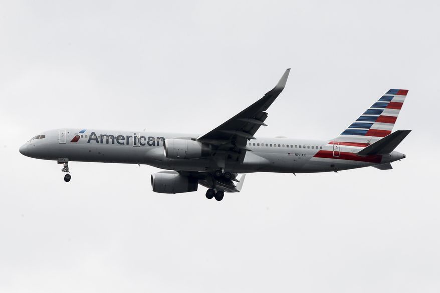 In this Nov. 7, 2019, file photo an American Airlines jet approaches Philadelphia International Airport in Philadelphia. American Airlines reports financial results Thursday, Jan. 23, 2020. (AP Photo/Matt Rourke, File)