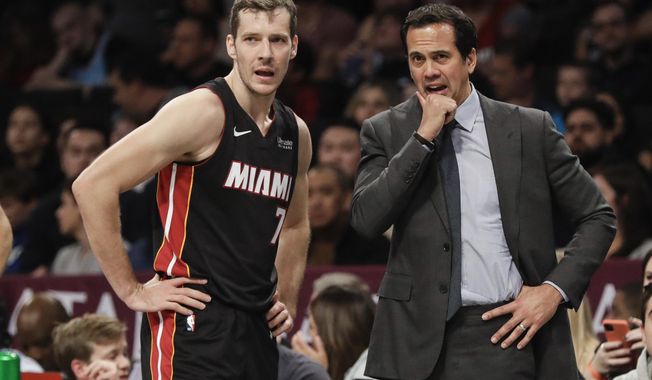 Miami Heat&#x27;s Goran Dragic, left, talks to coach Erik Spoelstra during the second half of the team&#x27;s NBA basketball game against the Brooklyn Nets on Friday, Jan. 10, 2020, in New York. The Nets won 117-113. (AP Photo/Frank Franklin II)