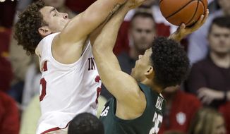 Indiana forward Race Thompson (25) blocks the shot of Michigan State forward Malik Hall (25) in the first half of an NCAA college basketball game in Bloomington, Ind., Thursday, Jan. 23, 2020. (AP Photo/Darron Cummings)