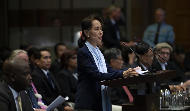 In this Dec. 11, 2019, file photo, Myanmar&#x27;s leader Aung San Suu Kyi addresses judges of the International Court of Justice for the second day of three days of hearings in The Hague, Netherlands. The United Nations&#x27; highest court is set to rule Thursday, Jan. 23, 2020, on whether to order Myanmar to halt what has been described as a genocidal campaign against the country&#x27;s Rohingya Muslim minority. The International Court of Justice decision comes in a case brought by the African nation of Gambia on behalf of an organization of Muslim nations that accuses Myanmar of genocide in its crackdown on the Rohingya. (AP Photo/Peter Dejong, File)