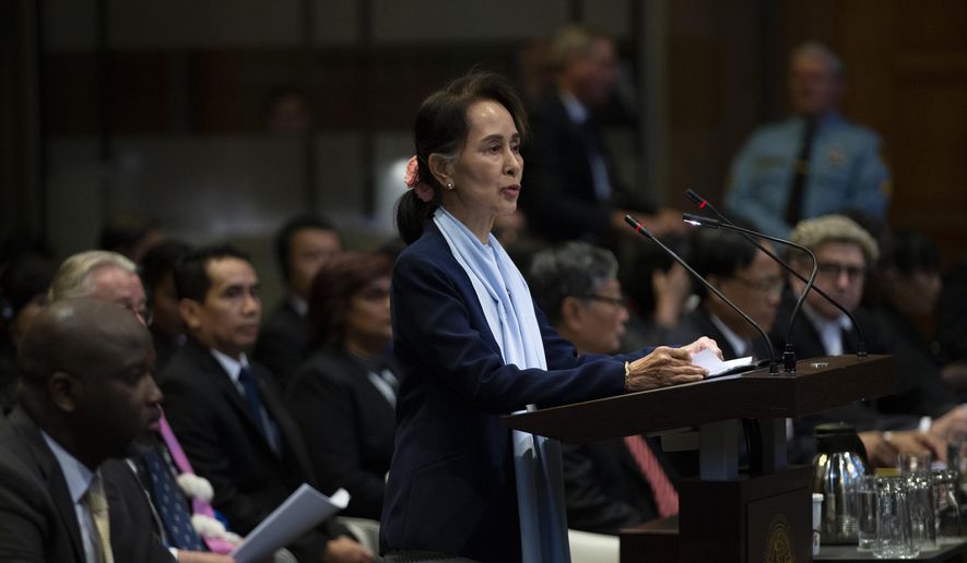 In this Dec. 11, 2019, file photo, Myanmar&#39;s leader Aung San Suu Kyi addresses judges of the International Court of Justice for the second day of three days of hearings in The Hague, Netherlands. The United Nations&#39; highest court is set to rule Thursday, Jan. 23, 2020, on whether to order Myanmar to halt what has been described as a genocidal campaign against the country&#39;s Rohingya Muslim minority. The International Court of Justice decision comes in a case brought by the African nation of Gambia on behalf of an organization of Muslim nations that accuses Myanmar of genocide in its crackdown on the Rohingya. (AP Photo/Peter Dejong, File)