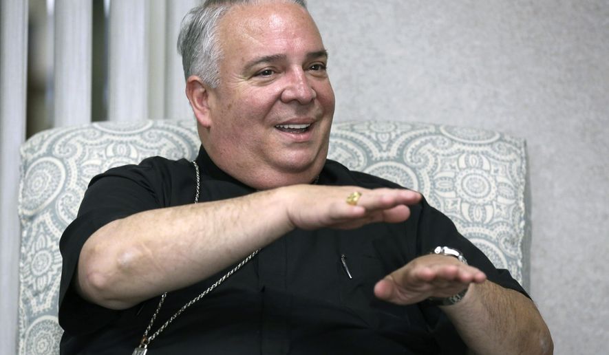FILE - In this May 30, 2018 file photo, Cleveland Catholic Diocese Bishop Nelson Perez talks during an interview in Cleveland. The Vatican announced Thursday, Jan. 23, 2020, that Perez will become the new leader of the Archdiocese of Philadelphia, making him the first Hispanic archbishop to lead the region’s 1.3 million-member flock. (Lisa DeJong/The Plain Dealer via AP, File)
