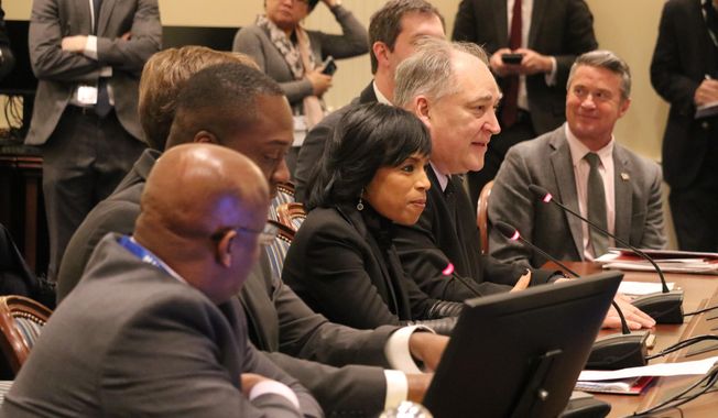 In this file photo, Montgomery County Executive Marc Elrich, second from right, and Prince George&#x27;s County Executive Angela D. Alsbrooks, third from right, are shown testifying in a state legislative hearing on Thursday, Jan. 23, 2020, in Annapolis, Md. (AP Photo/Brian Witte) ** FILE **