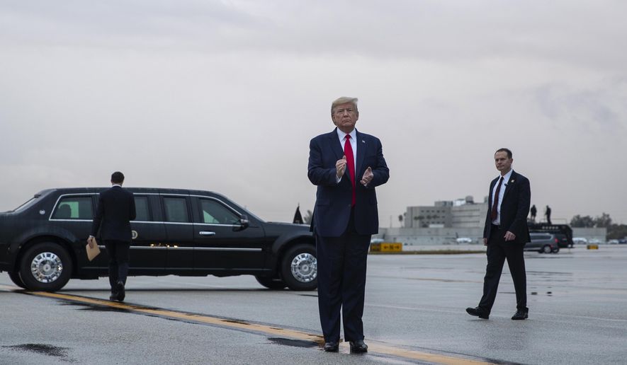President Donald Trump pauses as he arrives at Miami International Airport en route to attend the Republican National Committee winter meetings, Thursday, Jan. 23, 2020, in Miami. (AP Photo/ Evan Vucci)
