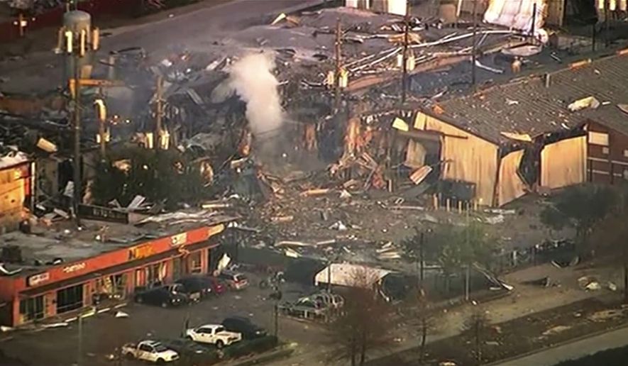 This aerial photo taken from video provided by KTRK-TV shows damage to buildings after an explosion in Houston on Friday, Jan. 24, 2020.  A large explosion left rubble scattered in the area, damaged nearby homes and was felt for miles away. A fire continues to burn and people have been told to avoid the area.  (KTRK-TV via AP)