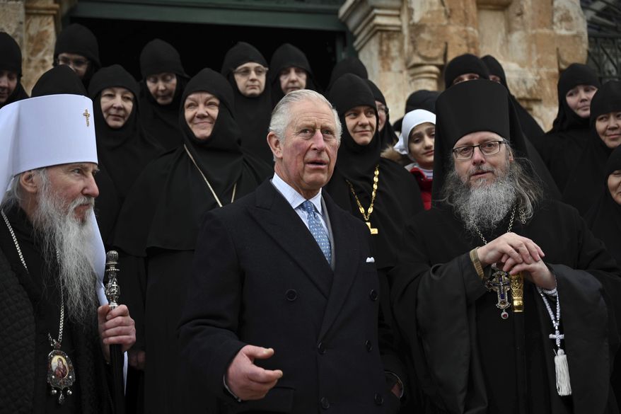 Britain's Prince Charles, center, arrives at the Church of St Mary Magdalene where Charles' grandmother Princess Alice is buried, in Jerusalem, Israel, Friday, Jan. 2020. Prince Charles is on a tour of Israel and Occupied Palestinian Territories. (Neil Hall/Pool Photo via AP)