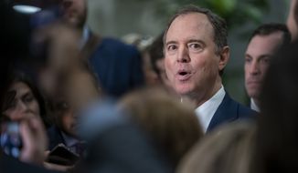 House Intelligence Committee Chairman Adam Schiff, D-Calif., is surrounded by reporters as he speaks about the impeachment trial of President Donald Trump on charges of abuse of power and obstruction of Congress, in Washington, Friday, Jan. 24, 2020. (AP Photo/J. Scott Applewhite)