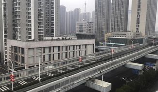 In this photo provided by Chen Yanxi, a nearly-deserted expressway is seen in Wuhan in central China&#39;s Hubei Province, Friday, Jan. 24, 2020. China’s attempt to stop a deadly virus by cutting off access to cities with 25 million inhabitants is a step few other governments would consider but is made possible by the ruling Communist Party’s extensive social controls and experience fighting the 2002-03 outbreak of SARS. (Chen Yanxi via AP)