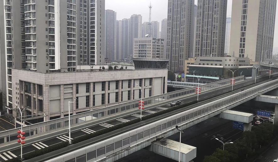 In this photo provided by Chen Yanxi, a nearly-deserted expressway is seen in Wuhan in central China&#x27;s Hubei Province, Friday, Jan. 24, 2020. China’s attempt to stop a deadly virus by cutting off access to cities with 25 million inhabitants is a step few other governments would consider but is made possible by the ruling Communist Party’s extensive social controls and experience fighting the 2002-03 outbreak of SARS. (Chen Yanxi via AP)
