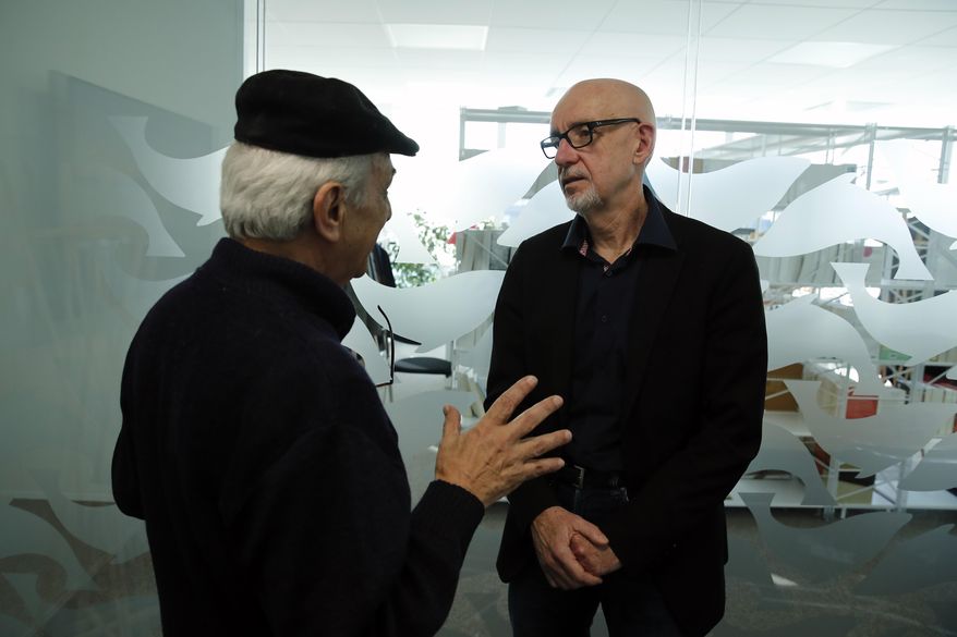 George Salines, right, whose daughter died in the Bataclan concert hall during the Nov. 13, 2015, attacks in Paris, and has written a book with Azdyne Amimour, left, whose son was among the gunmen that night, attend a joint interview in Paris, Tuesday Jan. 21, 2020. Both men lost children that night. The book, "We Still Have Words" is written as a dialogue between the two, to teach tolerance and resilience at a time when they say both seem in short supply. (AP Photo/Francois Mori)