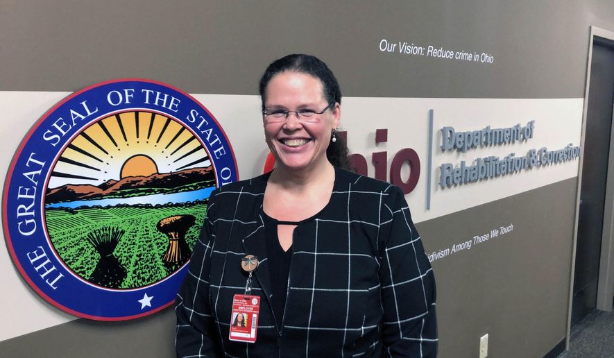 In this Wednesday, Jan. 22, 2020 photo, Annette Chambers-Smith, director of the Ohio Department of Rehabilitation and Correction, poses outside her office in Columbus, Ohio. Smith says the prisons agency wants to replace or renovate some of its high-security prisons in the near future, saying its current facilities for violent inmates are "functionally obsolete and creating security risks for the agency. (AP Photo/Andrew Welsh-Huggins)