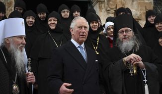 Britain&#39;s Prince Charles, center, arrives at the Church of St Mary Magdalene where Charles&#39; grandmother Princess Alice is buried, in Jerusalem, Israel, Friday, Jan. 2020. Prince Charles is on a tour of Israel and Occupied Palestinian Territories. (Neil Hall/Pool Photo via AP)