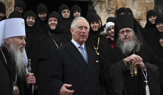 Britain&#x27;s Prince Charles, center, arrives at the Church of St Mary Magdalene where Charles&#x27; grandmother Princess Alice is buried, in Jerusalem, Israel, Friday, Jan. 2020. Prince Charles is on a tour of Israel and Occupied Palestinian Territories. (Neil Hall/Pool Photo via AP)