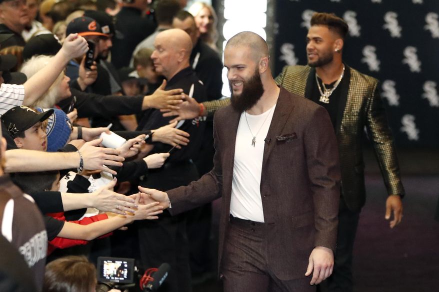 Chicago White Sox&#39;s Dallas Keuchel, center, is welcomed by fans after he was introduced during the team&#39;s annual fan convention Friday, Jan. 24, 2020, in Chicago. (AP Photo/Charles Rex Arbogast)