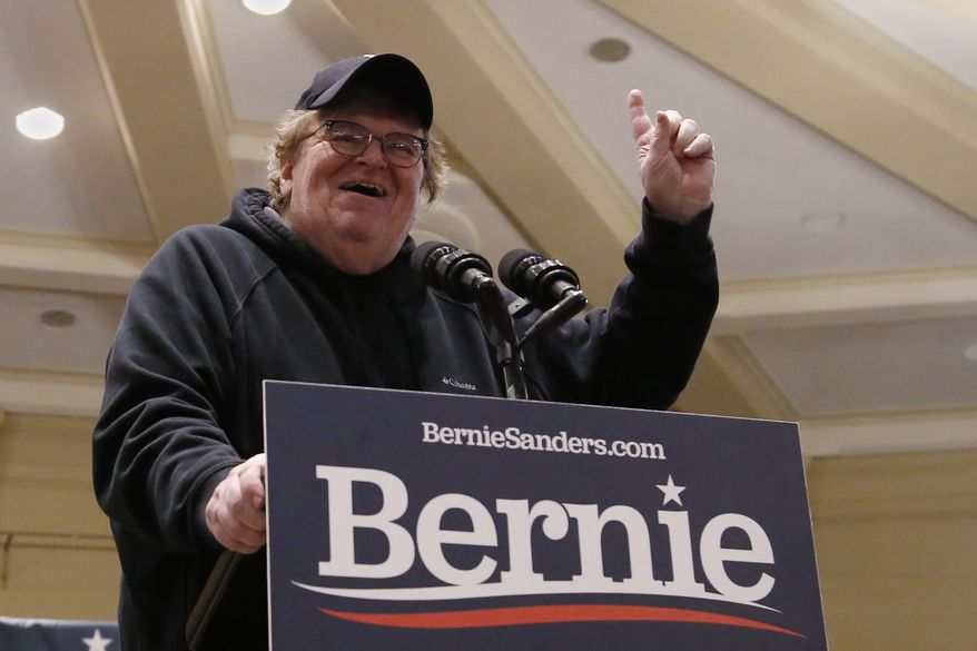 Michael Moore gestures as he speaks as a surrogate for Democratic Presidential Candidate Bernie Sanders Friday, Jan. 24, 2020, in Iowa City, Iowa. (AP Photo/Sue Ogrocki)