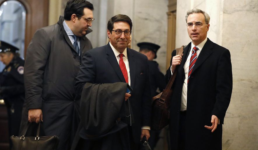 President Donald Trump&#x27;s personal attorney Jay Sekulow, center, stands with his son, Jordan Sekulow, left, and White House Counsel Pat Cipollone, while arriving at the Capitol in Washington during the impeachment trial of President Donald Trump on charges of abuse of power and obstruction of Congress, Saturday, Jan. 25, 2020. (AP Photo/Julio Cortez)