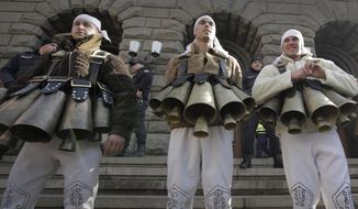 Bulgarian traditional Mummers protest against the alleged mismanagement of Bulgarian government that has led to a water crisis in Sofia, on Saturday, Jan.25, 2019.  Citizens have been protesting for weeks, holding authorities accountable for bringing their city to the verge of what they are calling a humanitarian crisis. (AP Photo/Valentina Petrova)
