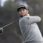 Jon Rahm of Spain hits his tee shot on the 14th hole of the South Course at Torrey Pines Golf Course during the third round of the Farmers Insurance golf tournament Saturday, Jan. 25, 2020, in San Diego. (AP Photo/Denis Poroy)