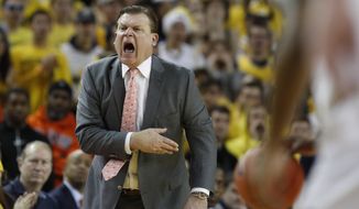 Illinois head coach Brad Underwood yells from the sideline during the first half of an NCAA college basketball game against Michigan, Saturday, Jan. 25, 2020, in Ann Arbor, Mich. (AP Photo/Carlos Osorio)