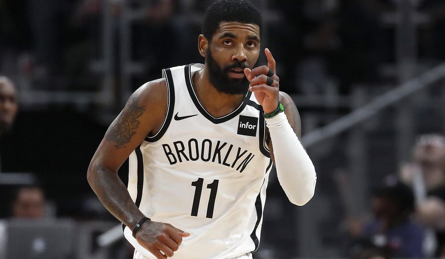 Brooklyn Nets guard Kyrie Irving (11) reacts after a basket in overtime of an NBA basketball game against the Detroit Pistons in Detroit, Saturday, Jan. 25, 2020. Brooklyn won 121-111. (AP Photo/Paul Sancya)