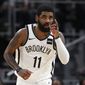 Brooklyn Nets guard Kyrie Irving (11) reacts after a basket in overtime of an NBA basketball game against the Detroit Pistons in Detroit, Saturday, Jan. 25, 2020. Brooklyn won 121-111. (AP Photo/Paul Sancya)