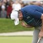 Marc Leishman, of Australia, pumps his fist on the 18th hole after winning the Farmer&#39;s Insurance Open at the Torrey Pines Golf Course, Sunday Jan. 26, 2020, in San Diego. (AP Photo/Denis Poroy)
