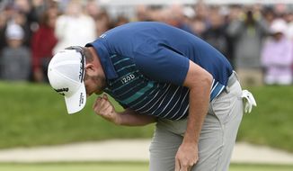 Marc Leishman, of Australia, pumps his fist on the 18th hole after winning the Farmer&#39;s Insurance Open at the Torrey Pines Golf Course, Sunday Jan. 26, 2020, in San Diego. (AP Photo/Denis Poroy)