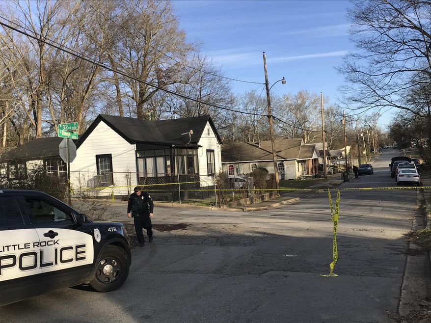Police work at the scene of a shooting at a residence in Little Rock, Ark., on Saturday, Jan. 25, 2020. Police in Arkansas say two women have been killed and a 2-year-old boy injured in a shooting at their home. (Thomas Metthe/The Arkansas Democrat-Gazette via AP)