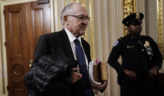Attorney Alan Dershowitz arrives at the Senate for the impeachment trial of President Donald Trump on charges of abuse of power and obstruction of Congress, at the Capitol in Washington, Monday, Jan. 27, 2020. (AP Photo/J. Scott Applewhite)