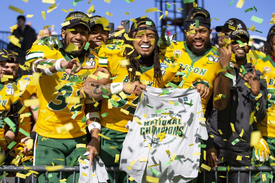 North Dakota State linebackers Jasir Cox (31), Aaron Mercadel (55), and Jabril Cox (42) celebrate after beating James Madison 28-20 in FCS championship NCAA college football game, Saturday, Jan. 11, 2020, in Frisco, Texas. (AP Photo/Sam Hodde)
