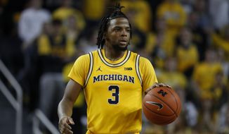 Michigan guard Zavier Simpson plays against Penn State in the second half of an NCAA college basketball game in Ann Arbor, Mich., Wednesday, Jan. 22, 2020. (AP Photo/Paul Sancya)