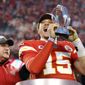 In this Jan. 19, 2020, photo, Kansas City Chiefs quarterback Patrick Mahomes holds the Lamar Hunt Trophy as he celebrates winning a NFL, AFC Championship football game against the Tennessee Titans in Kansas City, Mo. The most compelling dramas in the NFL this season unfolded on the field, not off of it. And any thought that the league was in jeopardy of losing its spot as America&#39;s favorite sport has been set on the back burner. (AP Photo/Colin E. Braley)  **FILE**