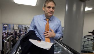 Rep. Jim Jordan, R-Ohio, walks in the U.S. Capitol during the impeachment trial of President Donald Trump on charges of abuse of power and obstruction of Congress, Tuesday, Jan. 28, 2020, on Capitol Hill in Washington. (AP Photo/Jose Luis Magana)