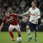 Middlesbrough&#39;s Adam Clayton, left, and Tottenham&#39;s Christian Eriksen challenge for the ball during the English FA Cup third round replay soccer match between Tottenham Hotspur and Middlesbrough FC at the Tottenham Hotspur Stadium in London, Tuesday, Jan. 14, 2020.(AP Photo/Matt Dunham)
