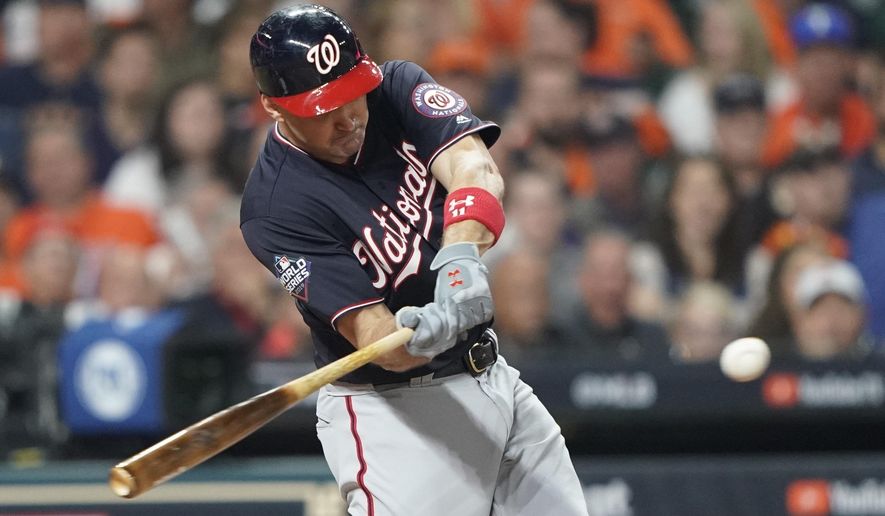 FILE - In this Oct. 22, 2019, file photo, Washington Nationals' Ryan Zimmerman hits a home run during the second inning of Game 1 of the baseball World Series against the Houston Astros in Houston. A person familiar with the negotiations tells the AP that “face of the franchise” Zimmerman and the Nationals have agreed to terms on a $2 million deal for 2020. The deal is pending a physical. (AP Photo/David J. Phillip, File)