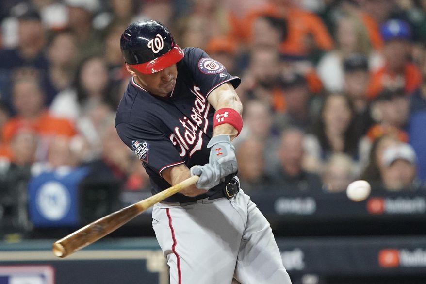FILE - In this Oct. 22, 2019, file photo, Washington Nationals' Ryan Zimmerman hits a home run during the second inning of Game 1 of the baseball World Series against the Houston Astros in Houston. A person familiar with the negotiations tells the AP that “face of the franchise” Zimmerman and the Nationals have agreed to terms on a $2 million deal for 2020. The deal is pending a physical. (AP Photo/David J. Phillip, File)