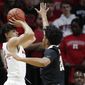 Rutgers guard Geo Baker (0) shoots a 3-pointer with Purdue guard Nojel Eastern (20) defending during the first half of an NCAA college basketball game Tuesday, Jan. 28, 2020, in Piscataway, N.J. (AP Photo/Kathy Willens)