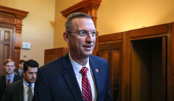 Georgia Rep. Doug Collins walks with colleagues at the state capitol in Atlanta, Tuesday, Jan. 28, 2020. (Riley Bunch/The Daily Times via AP) ** FILE **