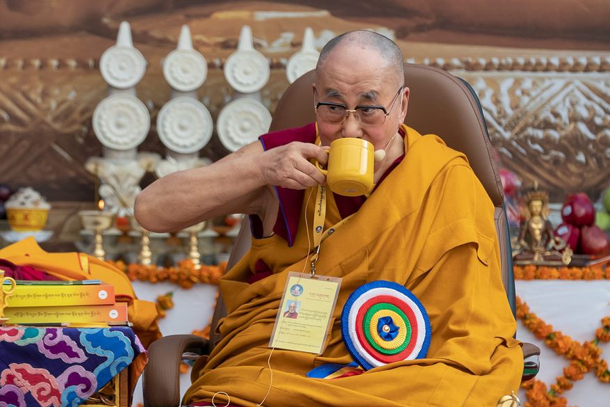Tibetan spiritual leader the Dalai Lama drinks tea during an event at the Kirti Monastery in Dharmsala, India, Saturday, Dec. 7, 2019. Tibetan spiritual leader the Dalai Lama presided over a function marking the 25th founding anniversary of the monastery in exile. (AP Photo/Ashwini Bhatia)