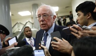 Sen. Bernie Sanders, I-Vt., speaks with reporters during the impeachment trial of President Donald Trump on charges of abuse of power and obstruction of Congress on Capitol Hill in Washington, Wednesday, Jan. 29, 2020. (AP Photo/Patrick Semansky)